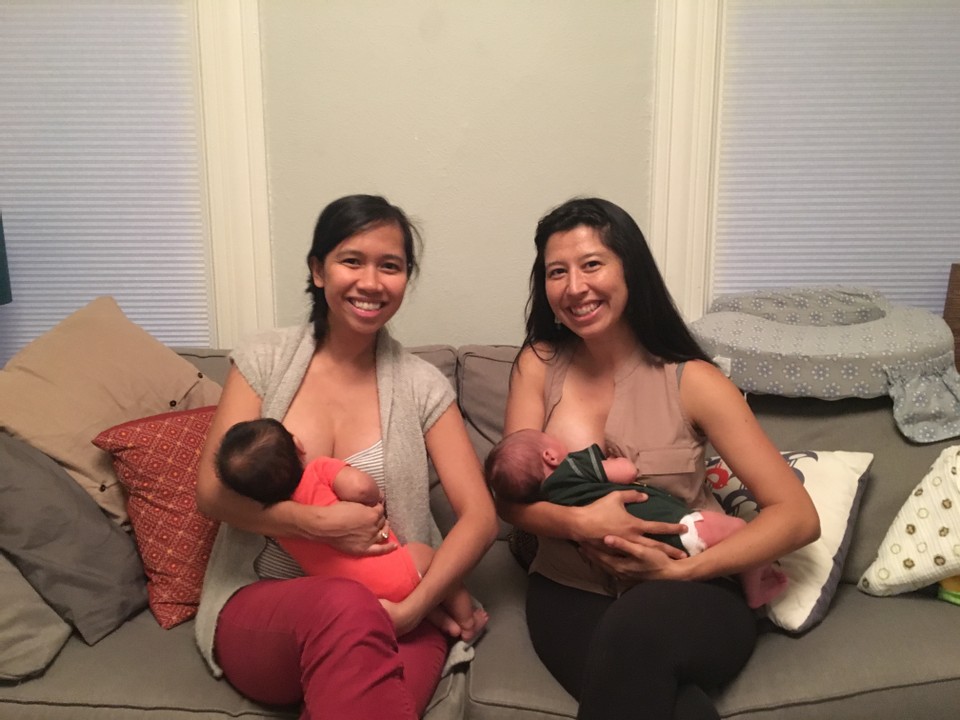 Angel and Angelica smile at the camera as they sit and breastfeed their beautiful brown bebes!