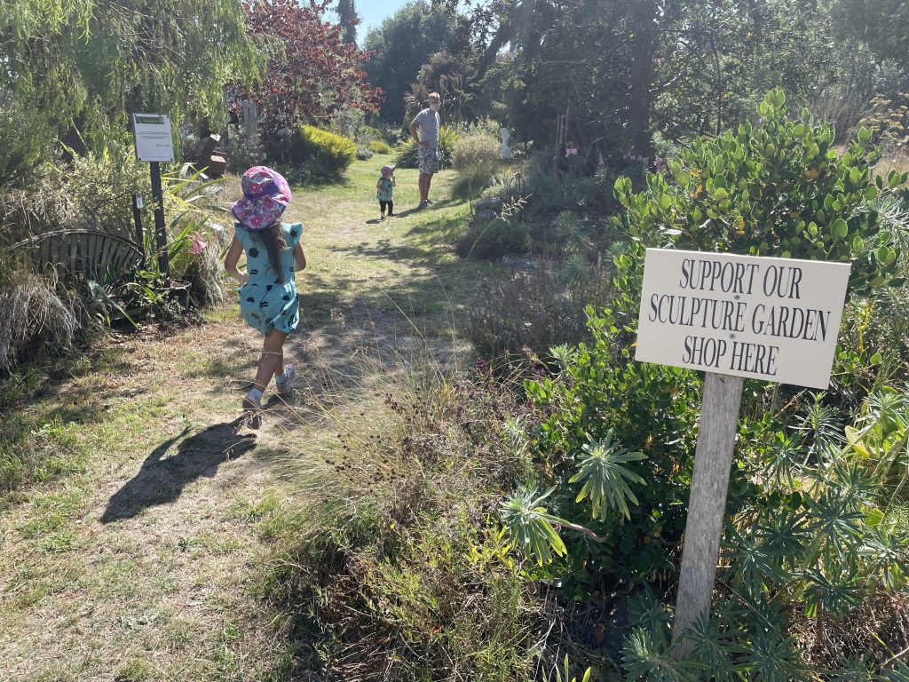 A child walking through Sierra Azul Sculpture Gardens in Watsonville California
