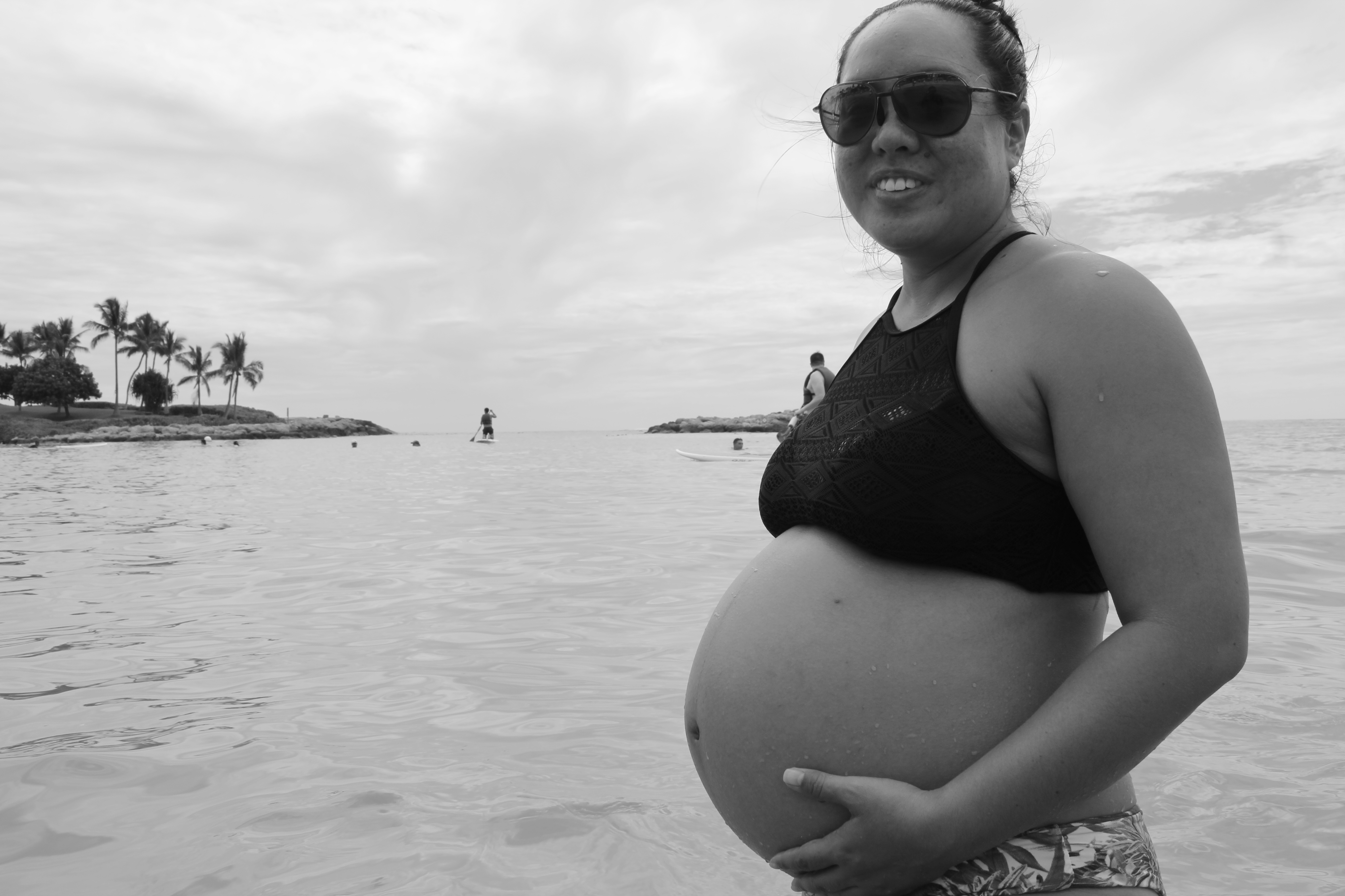 pregnant person at the beach in Hawaii before a home birth