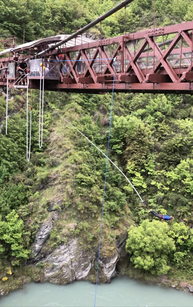 A rope suspended over a bridge as a person is about to bungee jump in Otago New Zealand