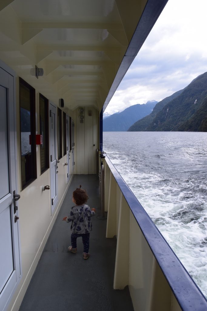 Child walking along the cruise ship in the Doubtful Sound New Zealand