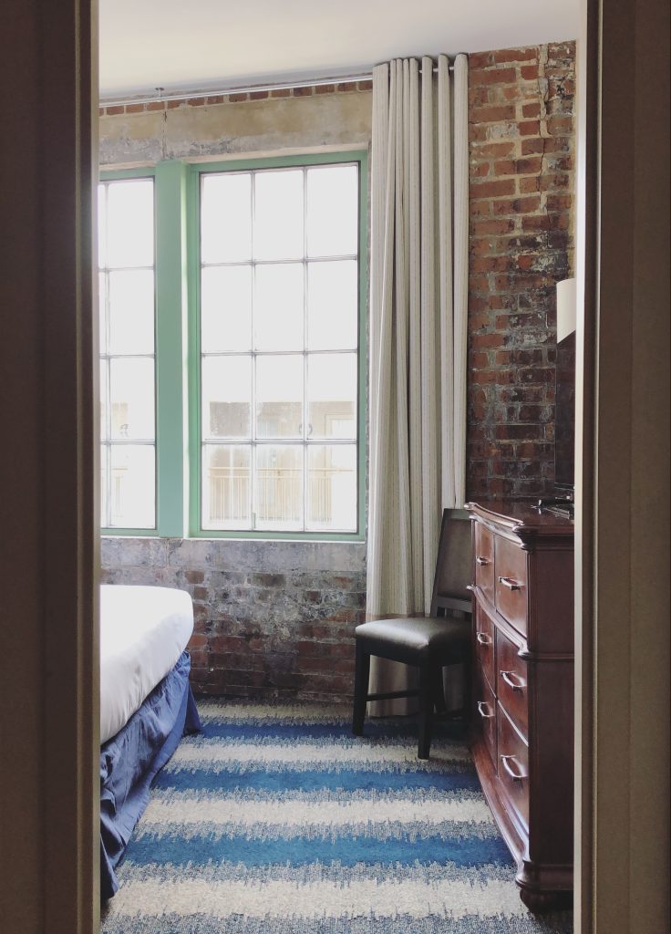 a view of a bedroom through a doorway