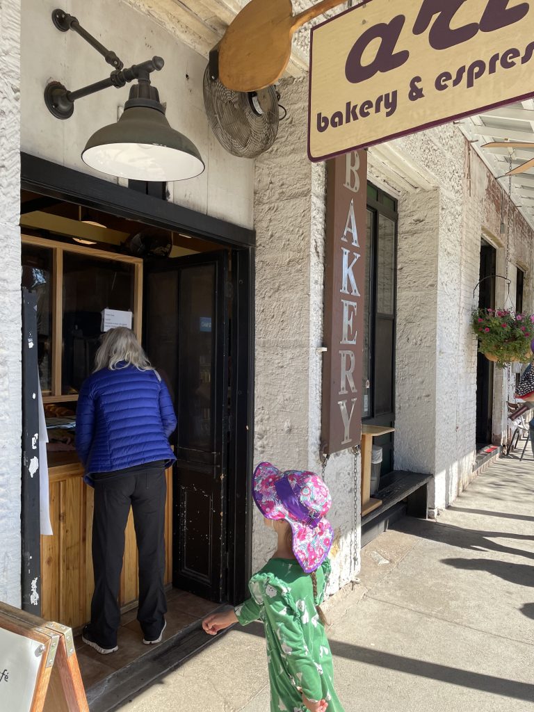Child waiting in line for cookies at Aria Bakery in Murphys on Main Street
