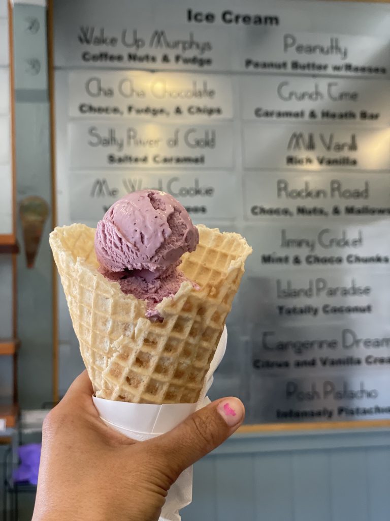 Purple ice cream in a waffle cone from JoMas Ice Cream in Murphys on Main Street
