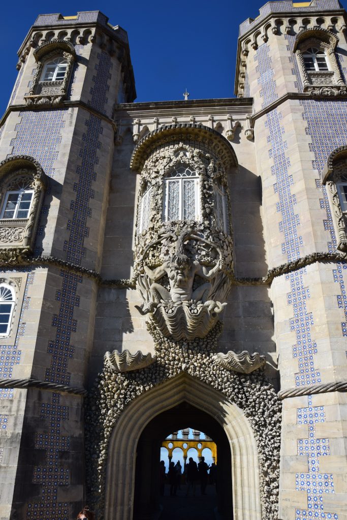 A statue of Triton over an archway in Pena Palace, Sintra Portugal