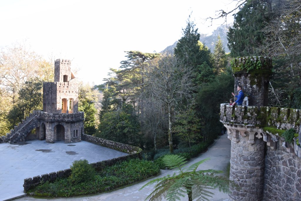 Climbing the turret at Quinta da Regaleira with a child and adult in Sintra Portugal