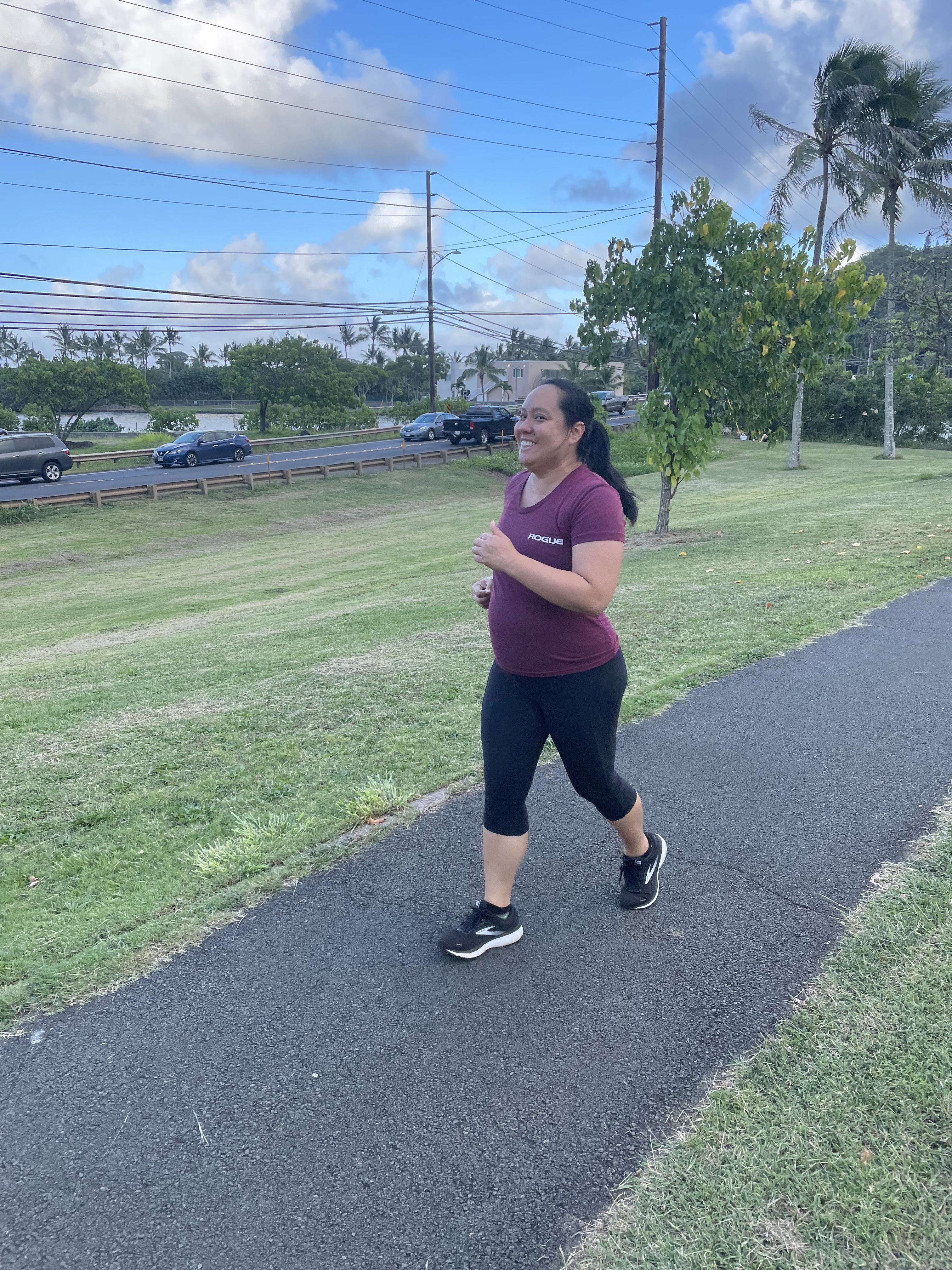 Pregnant person running in Hawaii before a home birth
