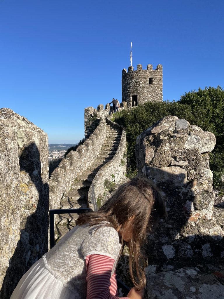 Child within view of the Torre Real at Moorish Castle