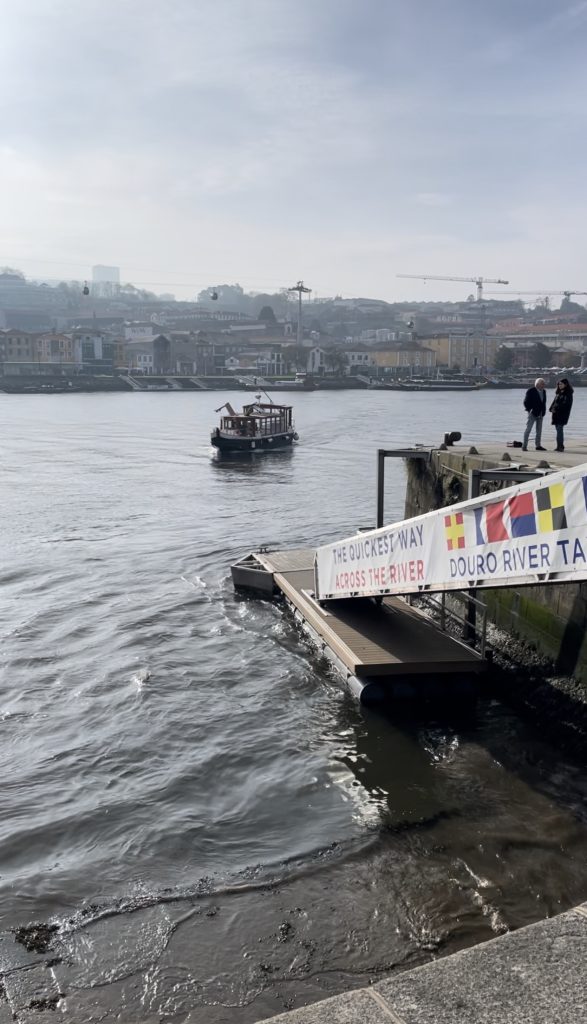 Douro River Water Taxi docking at Cais de Ribeira in Porto Portugal