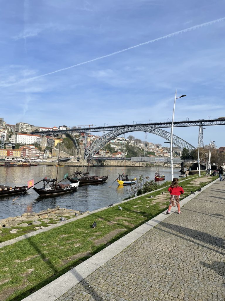 child running along Vila Nova de Gaia in Porto Portugal