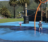 Child playing in the splash pad at the Picton Foreshore NZ