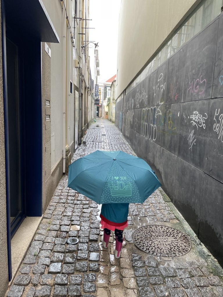 child walking down a stone path in Aviero Portugal