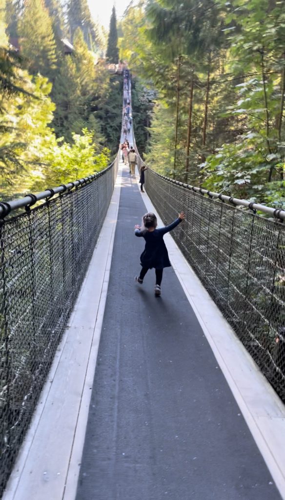 A child stumbling across the Capliano Suspension Bridge in Vancouver