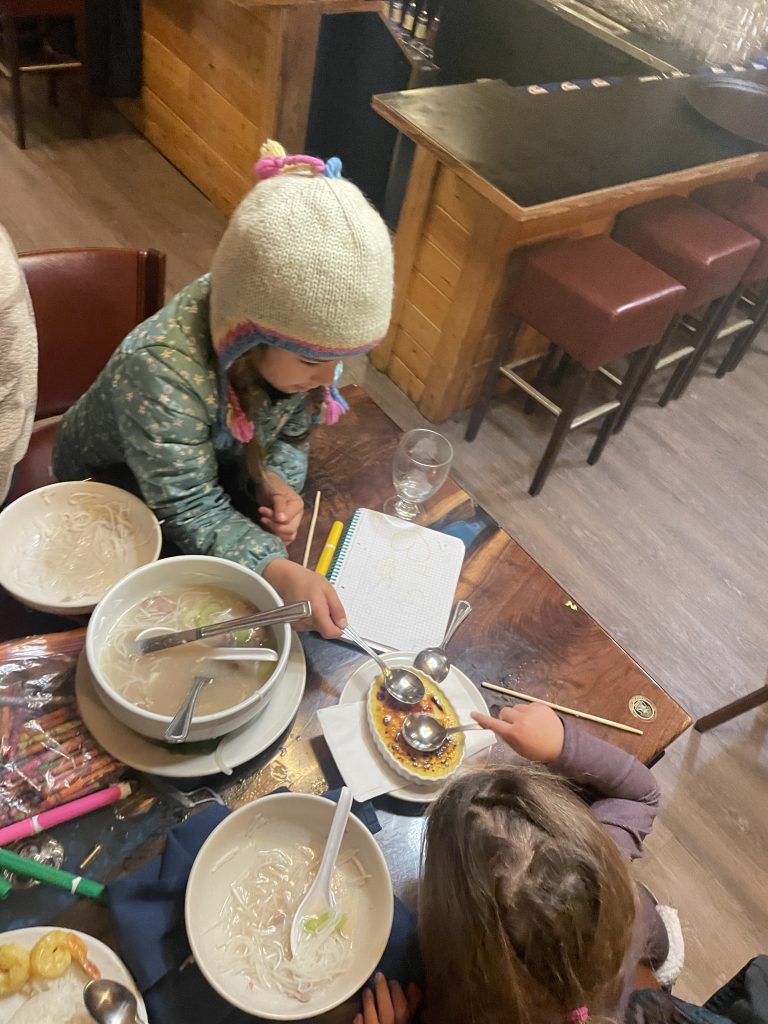 A child eating noodle soup at Chena Hot Springs' restaurant in Fairbanks, Alaska