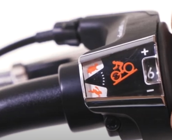 Guardian bike gear shift on handle bar. A tiny little orange biker moving up or down